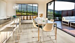 Modern kitchen and dining area on the wooden floor